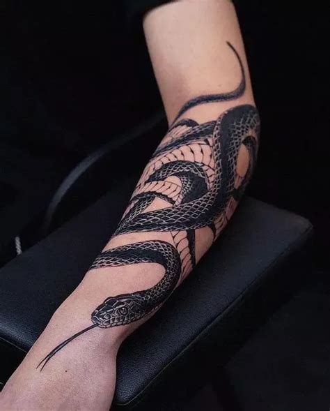 snake wrapped around arm tattoo|Wrap around snake tattoo arm